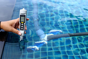 Pool technician troubleshooting salt levels in a swimming pool
